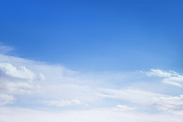 Blue sky with white fluffy cirrus clouds soft focus. Heavenly clouds background summer. Concept of freedom, relaxation, ecology. Copy space. Empty space.