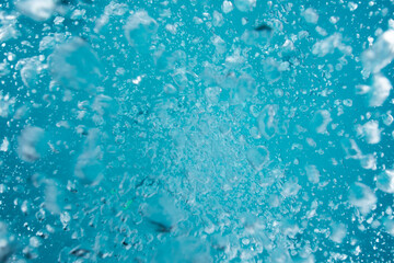 Air bubbles float to the surface of the water background. - 496498592