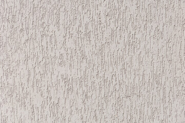 Texture of beige plaster building coating background