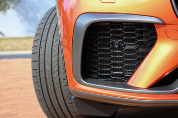 Close up of an orange car air intake - obrazy, fototapety, plakaty