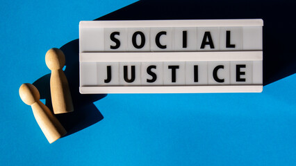 Lightbox with message SOCIAL JUSTICE. Motivational Words Quotes Concept. Colorful blue background....