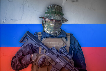 Angry russian soldier armed with a rifle with russia flag as background behind