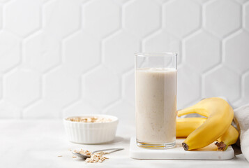 Banana smoothie. Milkshake with banana and oatmeal , healthy breakfast.