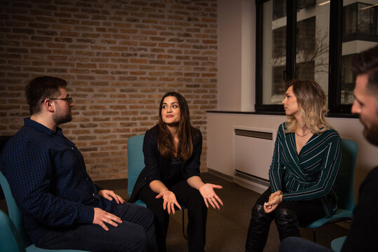 a woman shares her experiences at the group therapy seasion