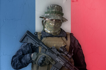 Angry french soldier armed with a rifle with france flag as background behind