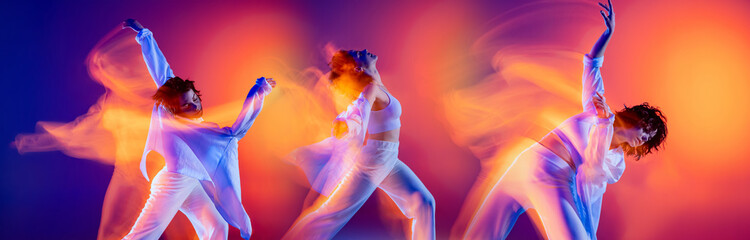Young flexible girl, hip-hop dancer in white clothes dancing isolated on bright background with mixed neon light.