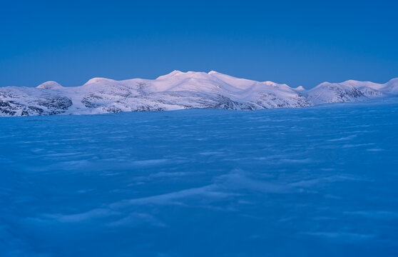 Dusk In The Snow Covered Mountains In Swedish Lapland, Near The Famous Kungsleden.