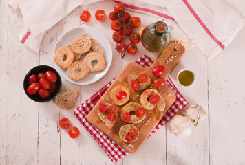 Friselle with cherry tomatoes and olive oil.