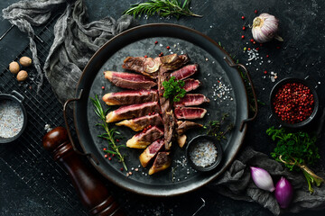 Chopped juicy porterhouse steak or T Bone Steak dry aged of beef Ready to Cook on wooden Board with...