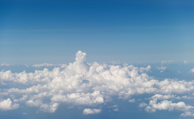 Fototapeta na wymiar Top view cloudy mountains from a plane