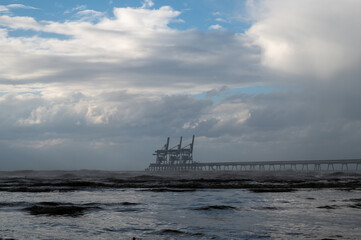 Open water terminal at sea with cranes for unloading and loading large ships at sea.