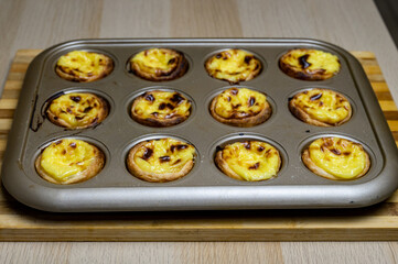 Egg tart, traditional Portuguese dessert, pastel de nata. Freshly baked.