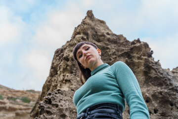 Naklejka premium Woman looking at the camera in a low angle view