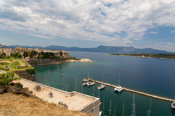 corflu city in spring view from fortress sea ships green trees in greece