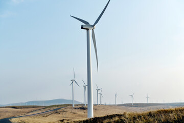 Fototapeta premium Wind turbines on autumn landsape