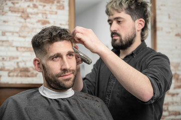 Obraz premium Work at the barber shop. High quality photo