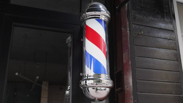 Barber Pole Retro Swirl Sign at Hairdresser Store Exterior