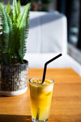orange or apple fresh on a sunny table healthy summer refreshment
