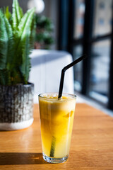 orange or apple fresh on a sunny table healthy summer refreshment