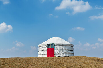 Yurt on top of hill in autumn