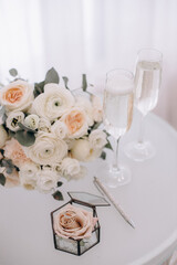 wedding rings in a beautiful box with flowers
