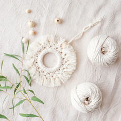 Macrame cotton decor. Natural materials - cotton thread, wood beads. Eco decorations, ornaments, hand made decor. Copy space