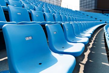 Naklejka premium Empty blue seat in stadium