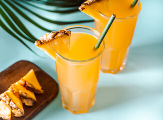 Summer refreshing tropical drink juice or cocktail with pineapple juice and tequila.
