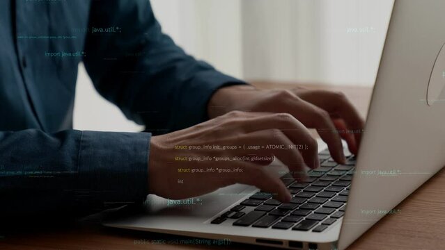 Computer programmer uses capable laptop computer to develop programming code of new software . Computer specialist working on future coding application for software programming development .