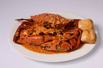 Tuinposter SINGAPOREAN CHILI CRAB with sauce in a dish top view on grey background singapore food © Food Shop