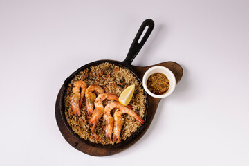 SHRIMPS AND ANDOUILLE JAMBALAYA in a dish top view on grey background singapore food
