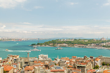Naklejka na ściany i meble Beautiful panorama of the historical city of Istanbul from the Galata Tower. Breathtaking panoramic view of the ancient city of Istanbul with historical sights and marble sea. 