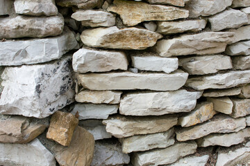 Hedge wall made of flat limestone stones