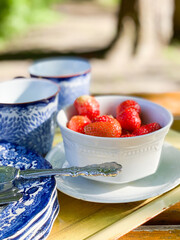 Strawberries in a white bowl.