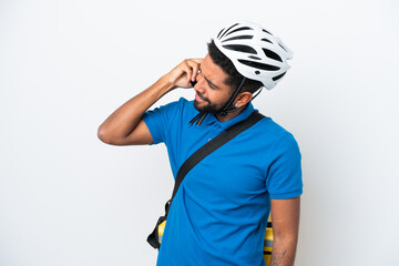 Young Brazilian man with thermal backpack isolated on white background keeping a conversation with the mobile phone with someone