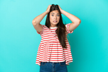 Young Brazilian woman isolated on blue background doing nervous gesture