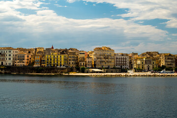 Fototapeta premium corfu city port and houses view from ship greece