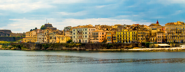 Naklejka premium corfu city port and houses view from ship greece