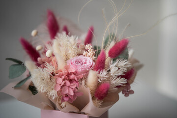 delicate composition of dry and stabilized flowers