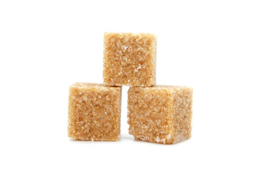 Pieces of Brown cane sugar isolated on white background. Three sugar cubes.