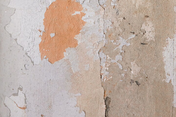 Peeling paint plaster with old weathered concrete obsolete wall cement worn texture messy background