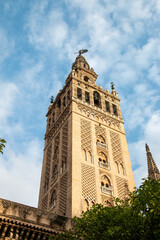 Fototapeta na wymiar Low angle view of bell tower over Seville cityscape, Andalusia, Spain