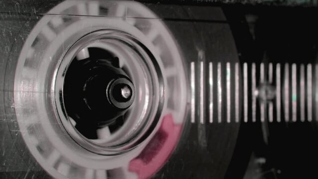 Vintage compact audio cassette playing.Macro shot