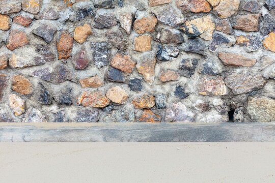 Brown natural stone concrete wall at the beach