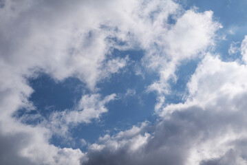 Fototapeta na wymiar A blurry image of white-gray clouds against a blue sky.sky background.