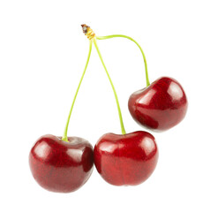 Three cherries and a green leaf isolated on a white background.