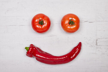 tomatoes and pepperoni builting a face, copy space