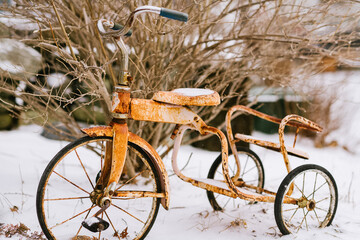 nature vermont old rusty tricycle in snow