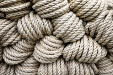 Jute rope in a rolls for background. Texture of twisted cords