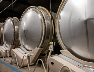 Production of sweet cassis creme liquor from ripe black currant berries, distillation and maceration in steel tanks,  Burgundy, France